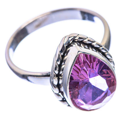 Oval faceted purple alexandrite-style gemstone ring with rope-twist silver band