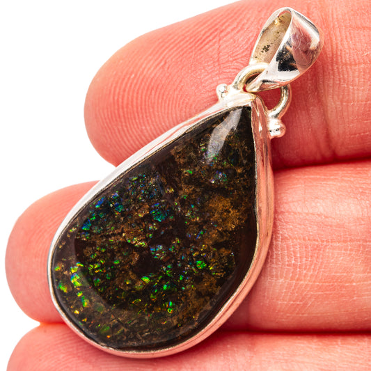 Sterling silver ammolite teardrop pendant with iridescent green and black stone