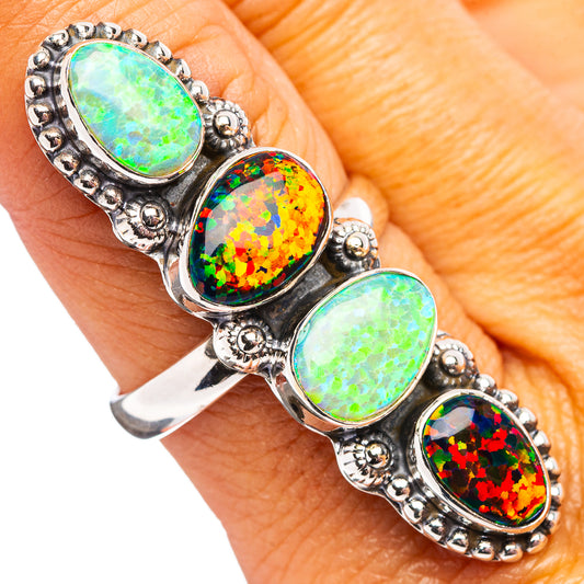 Oval opal-stone ring with four bezel-set colorful gems on dark silver band