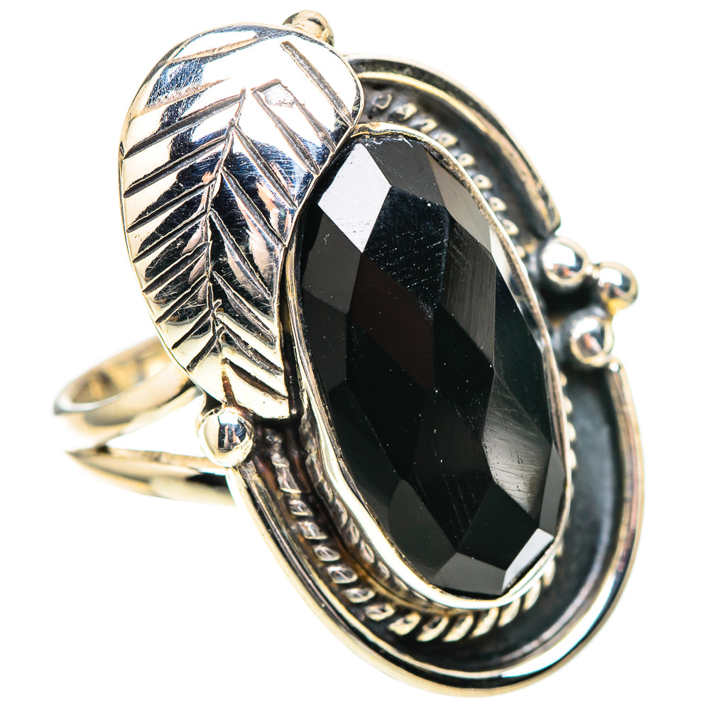 Sterling silver oval onyx ring, leaf motif band and decorative bezel with prongs
