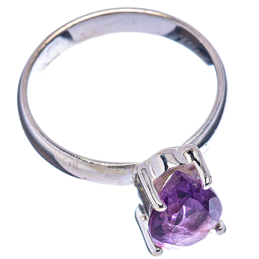 Faceted amethyst ring with oval purple gemstone in square silver bezel on polished band