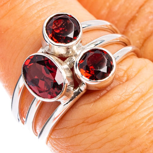 Sterling silver ring with three red garnet-like gemstones, size 6.5
