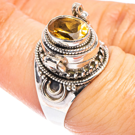 Oval yellow gemstone sterling silver ring with engraved, beaded halo details