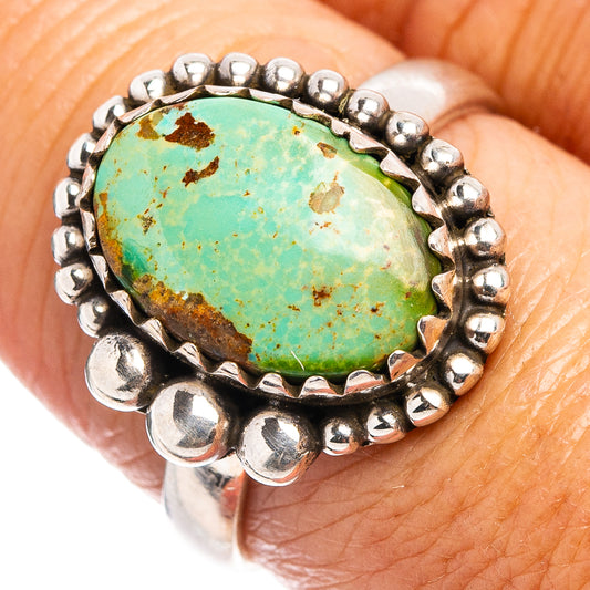 Sterling silver ring with turquoise oval cabochon and beaded bezel, close-up