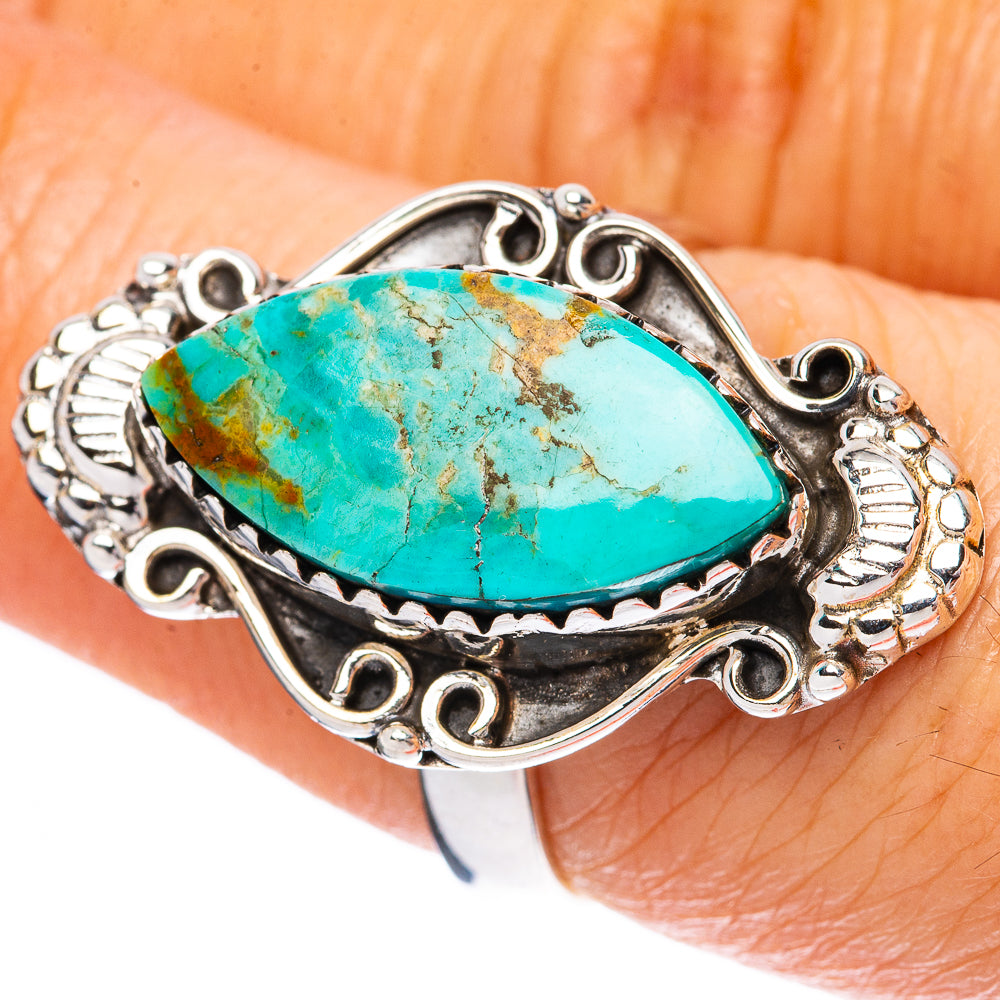 Sterling silver turquoise cabochon ring with oval stone, ornate bezel