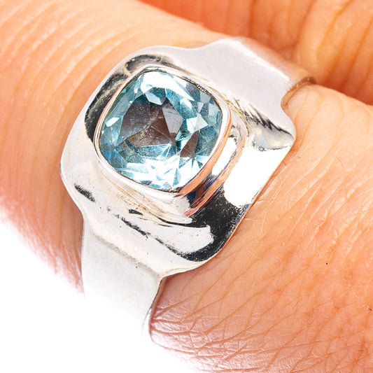 Sterling silver ring with blue topaz-style oval gemstone, textured setting