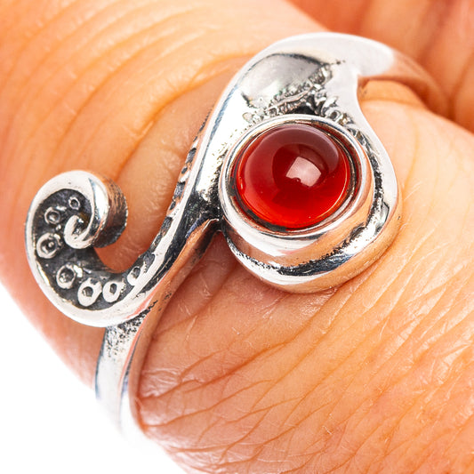 Sterling silver dainty ring with red oval carnelian cabochon and wave engraving