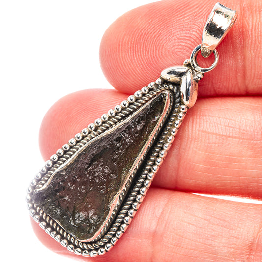 Sterling silver moldavite pendant with dark teardrop stone, beaded bezel and open bail