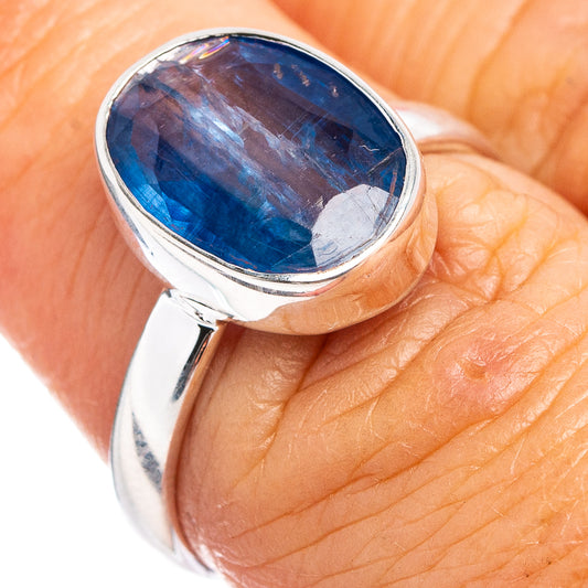 Sterling silver ring size 7 with oval blue gemstone bezel, worn on finger