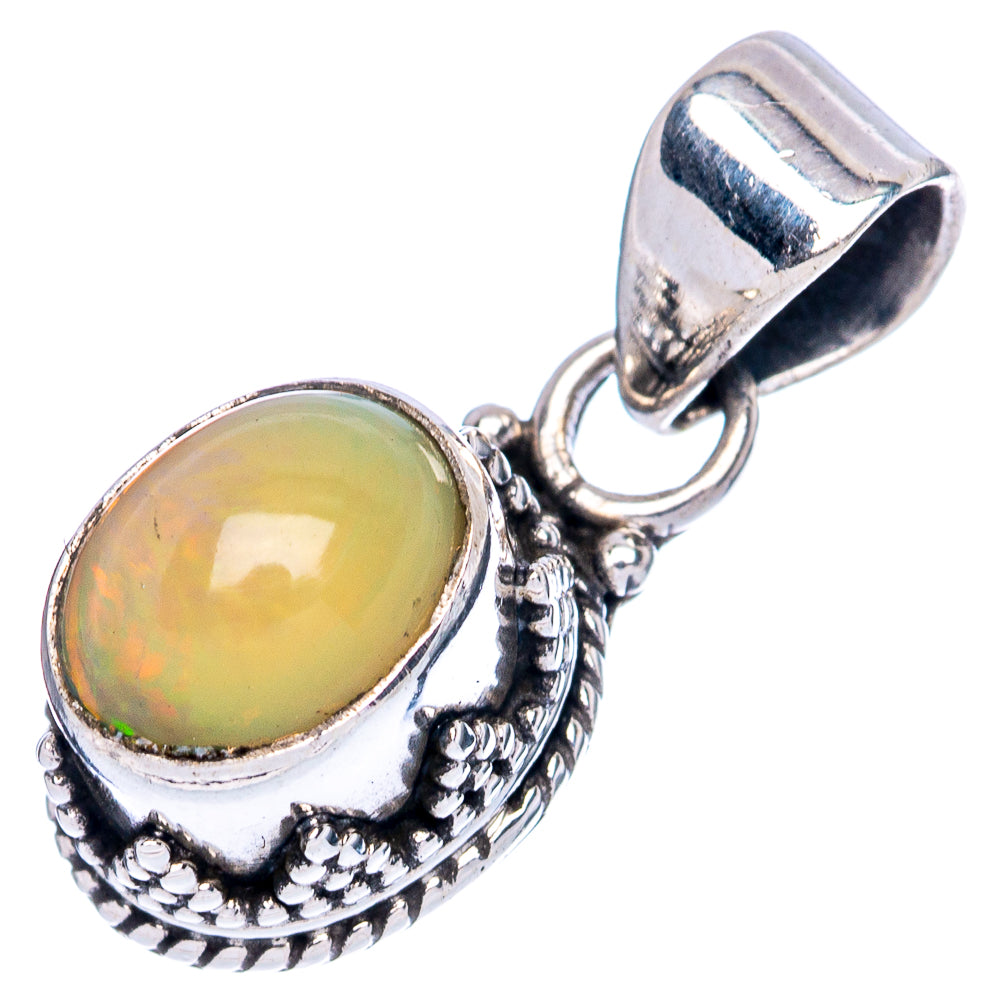 Ethiopian opal pendant with oval opal cabochon and detailed silver drop-style setting