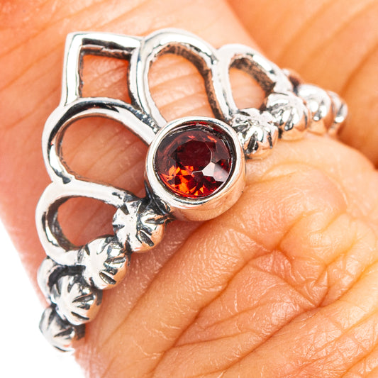 Sterling silver dainty ring with round garnet-red center and crown setting