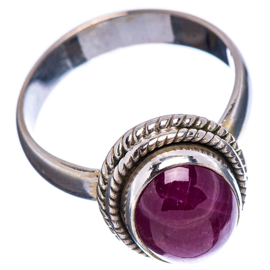 Sterling silver ruby ring, oval deep purple cabochon with textured shoulders and plain band