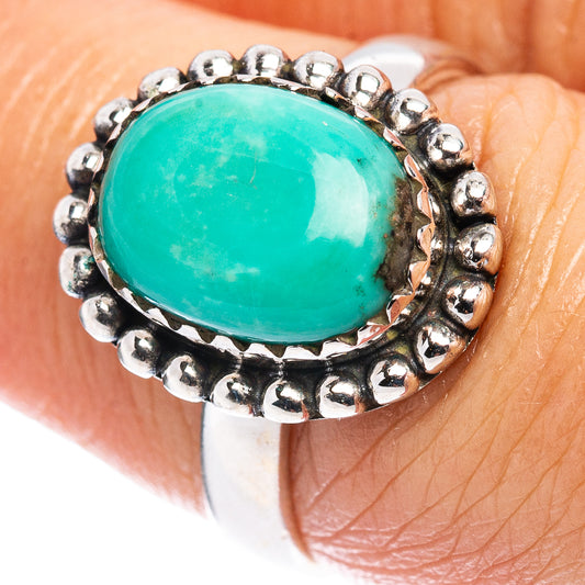 Oval turquoise cabochon ring in .925 sterling silver with bead-detail bezel