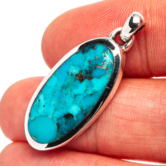 Sterling silver turquoise oval pendant with loop bail and white metal border