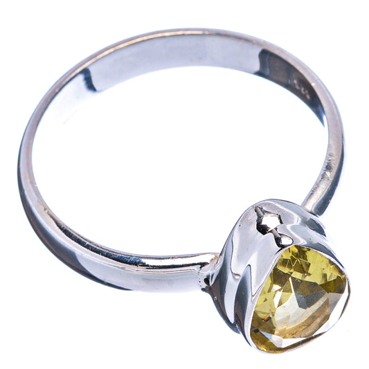 Sterling silver ring with faceted lemon quartz round setting, side view