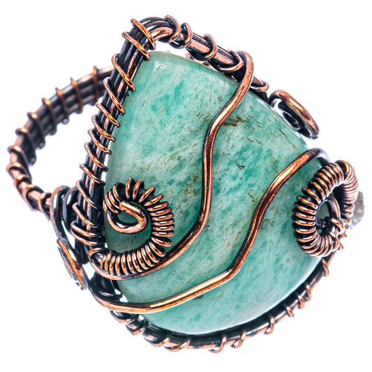 Oxidized copper wire wrap ring with turquoise oval stone and openwork spiral frame