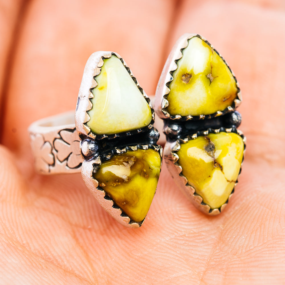 Southwestern silver ring with three triangular yellow stones in dark bezel
