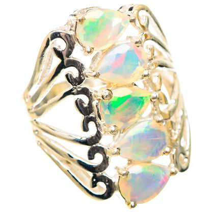 Sterling silver opal ring with three faceted oval stones, ornate openwork sides, size 7.25.