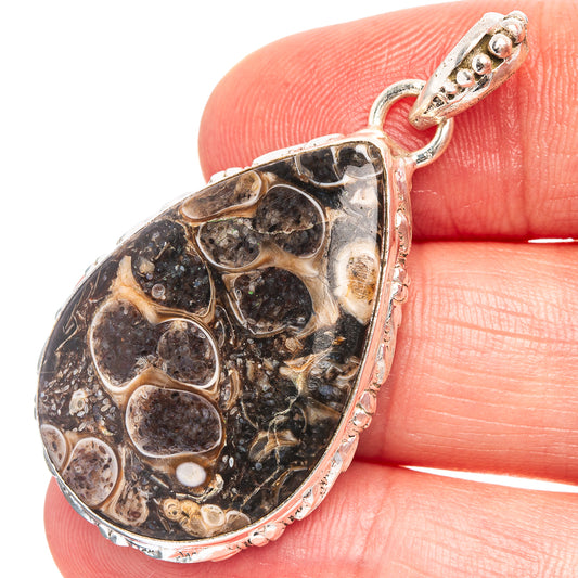 Turritella agate teardrop pendant in .925 sterling silver, detailed stone with silver bezel