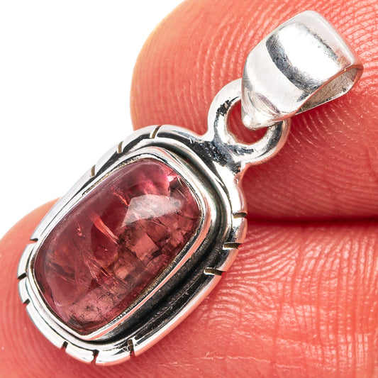 Sterling silver pendant with oval pink tourmaline gemstone set in a bezel