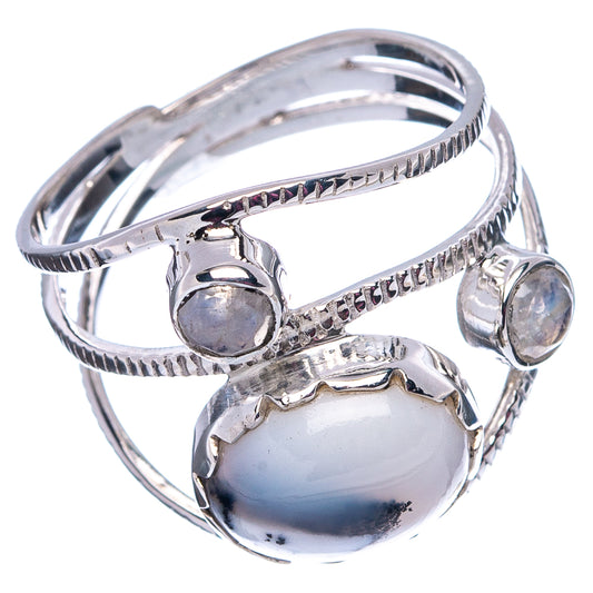 Sterling silver ring with engraved band, two round prong-set opal accents, oval center