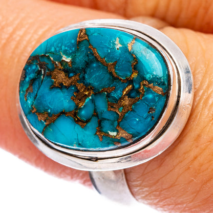 Sterling silver ring with round turquoise composite cabochon and copper web detail