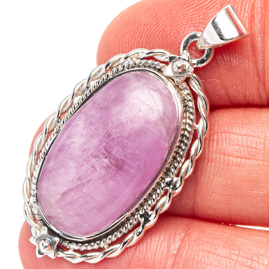 Oval purple kunzite pendant in .925 sterling silver with ornate braided bezel