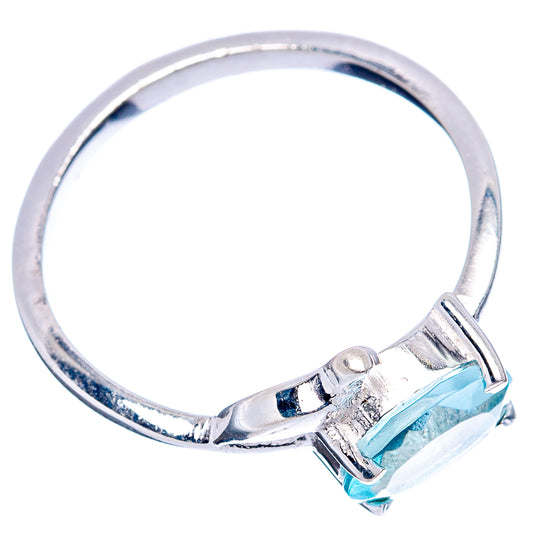 Sterling silver ring band with raised blue topaz stone and bird-style setting, size 6.5