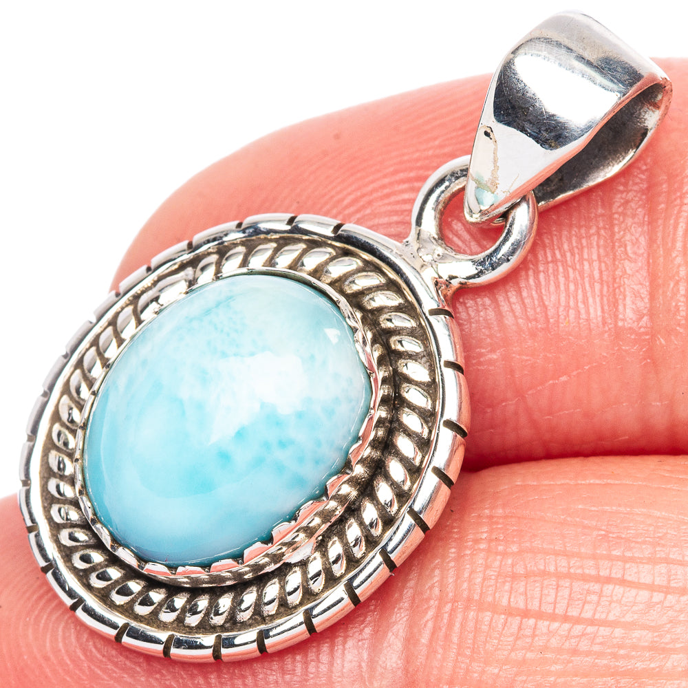 Oval larimar pendant in 925 sterling silver with ornate bezel and bail