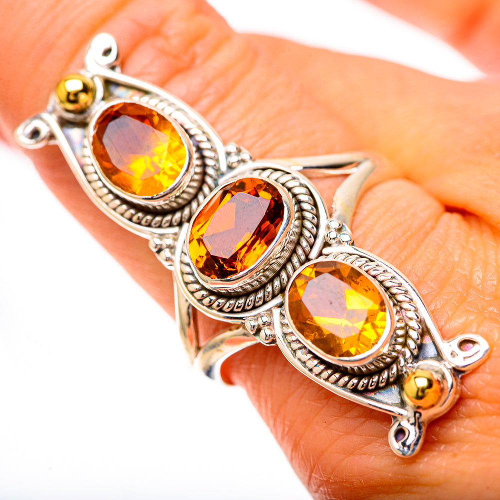 Faceted citrine-color oval ring in 925 sterling silver, three ornate stone settings