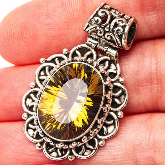 Sterling silver pendant with oval golden topaz-style gemstone and ornate filigree frame