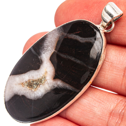 Black banded agate pendant, oval cabochon with silver-plated bail and loop