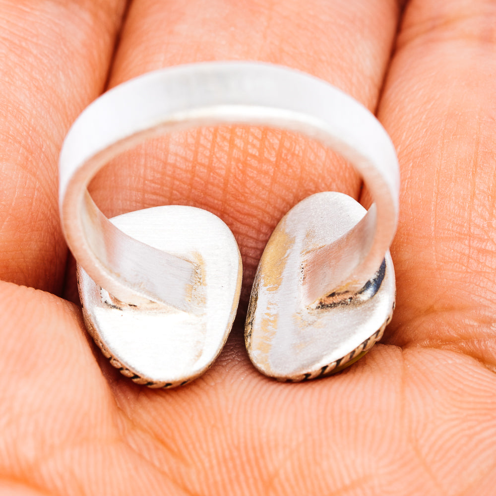 Sterling silver adjustable ring with open back and worn finish, curved oval setting