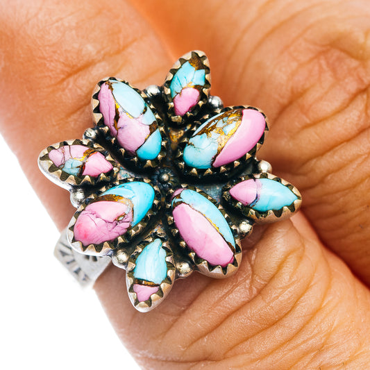 Southwestern flower ring with turquoise & pink inlay stones on dark metal, silver band