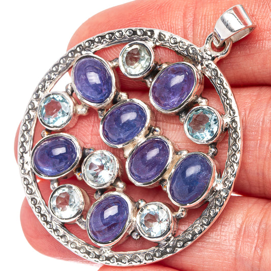 Sterling silver gemstone pendant with purple-blue oval stones and round icy-blue accents