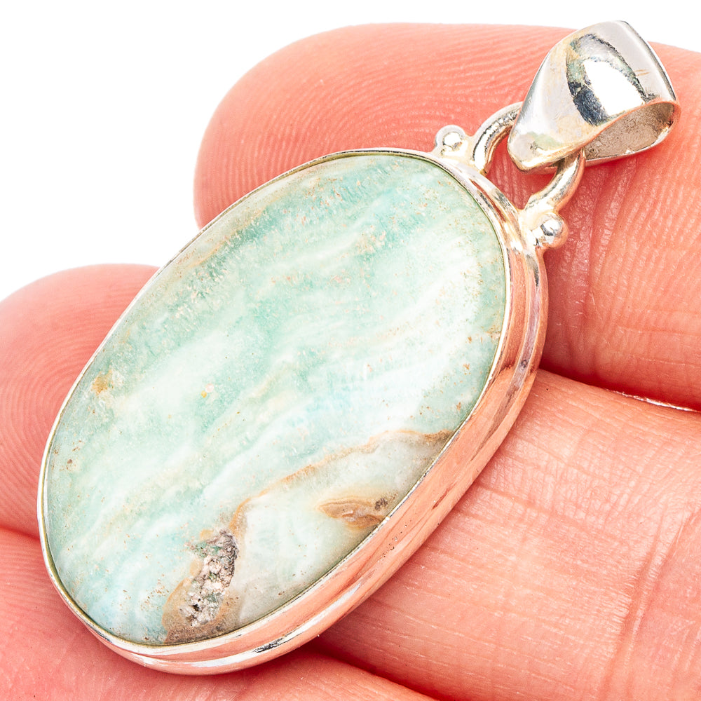 Oval aragonite pendant in sterling silver, light blue-green stone with bezel setting