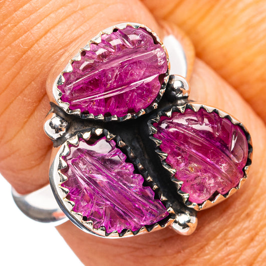 Sterling silver ring with three oval carved magenta ruby stones, claw-set