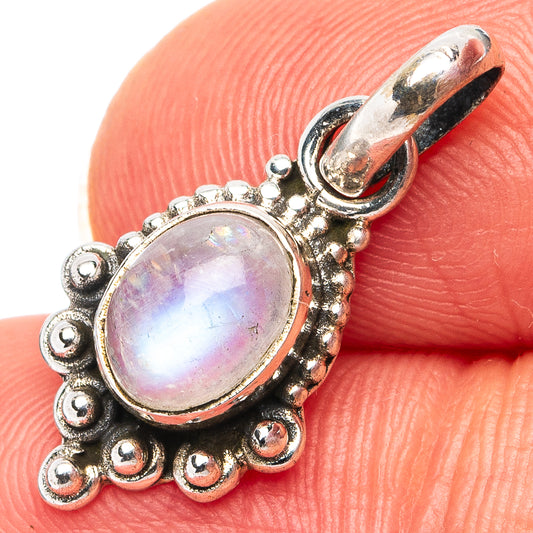 Sterling silver pendant with oval rainbow moonstone cabochon and beaded halo