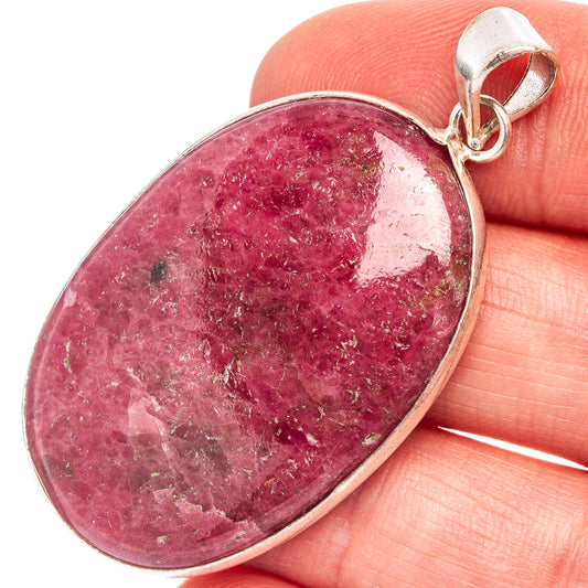 Rhodonite pendant with oval pink stone in silver-plated bezel and bail