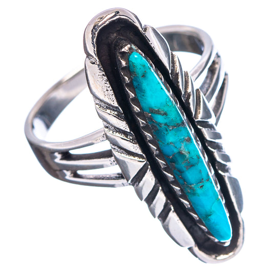 Sterling silver turquoise oval ring with dark bezel and decorative split shank