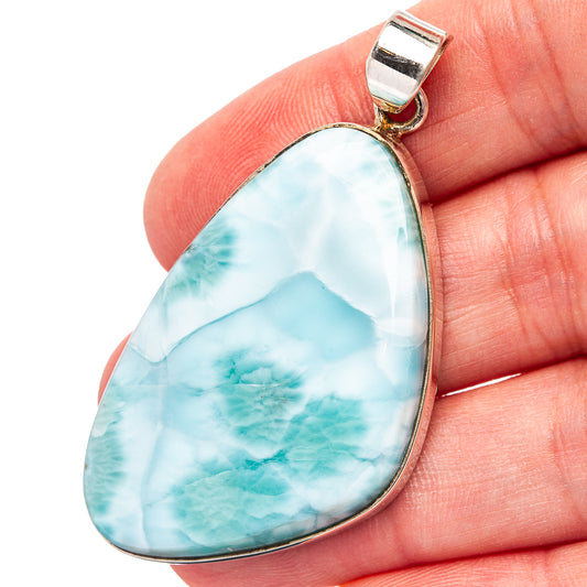 Larimar teardrop pendant with .925 sterling silver bail, light blue stone