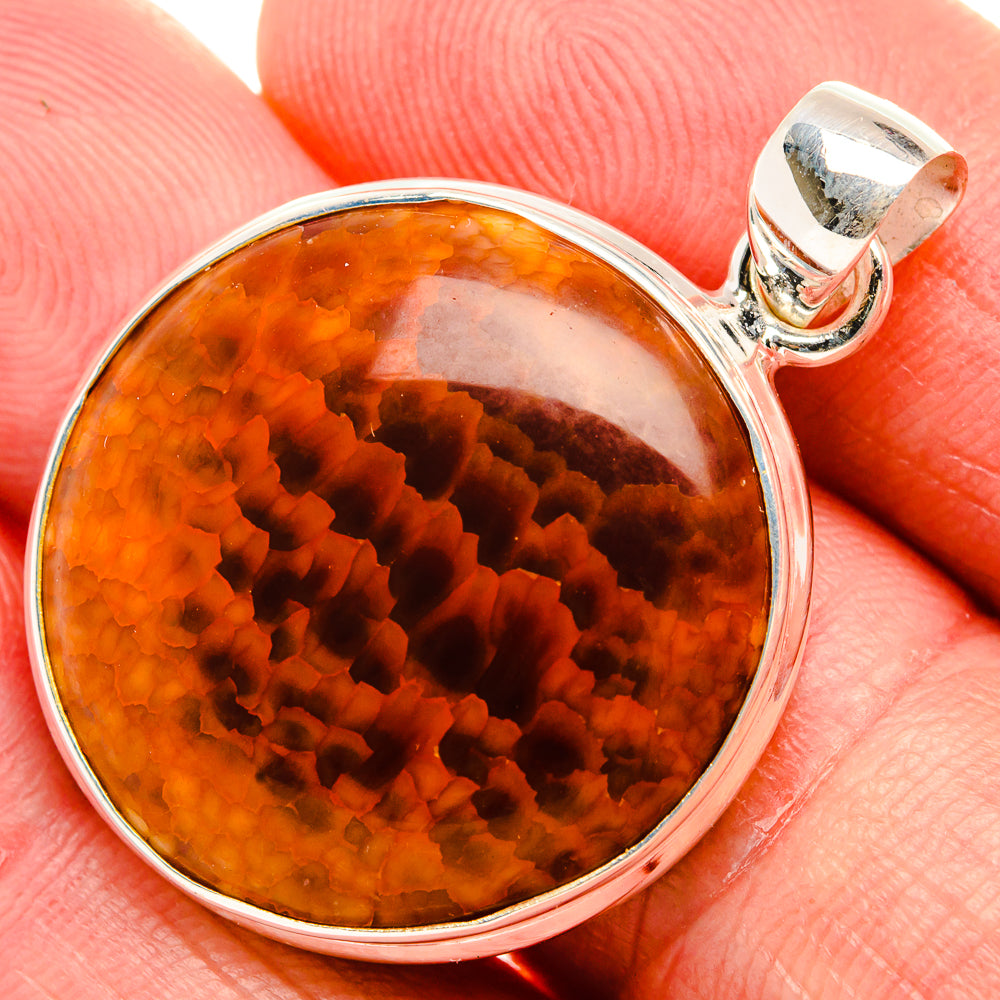 Round orange-red agate cabochon sterling silver pendant with bail