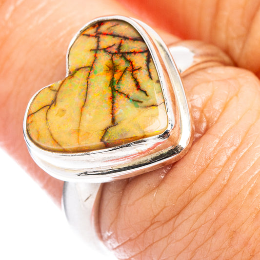 Sterling silver heart-shaped opal ring with colorful green, orange, and black inlay