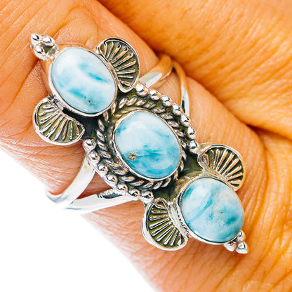 Sterling silver ring with three oval blue Larimar cabochons and leaf-style accents