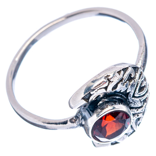 Sterling silver ring with red round gemstone and vintage-style scroll band