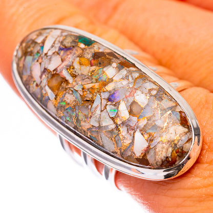 Sterling silver oval opal mosaic ring on finger, bright multicolor stone facets