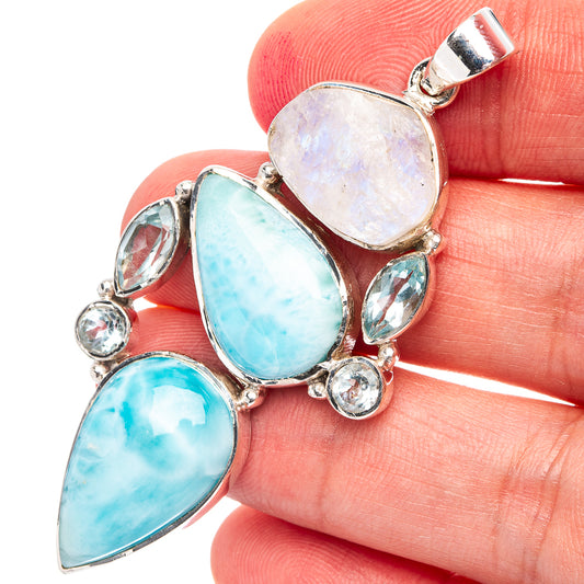 Sterling silver pendant with oval opal-like and blue-green gemstone drops and rounds