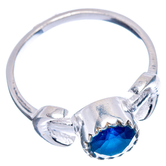 Sterling silver ring with round faceted blue gemstone and sculpted band tips