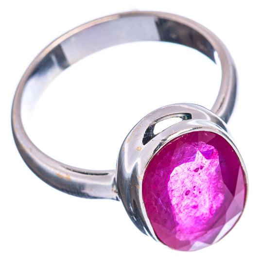 Faceted oval pink-red gemstone ring with polished .925 sterling silver band, side view