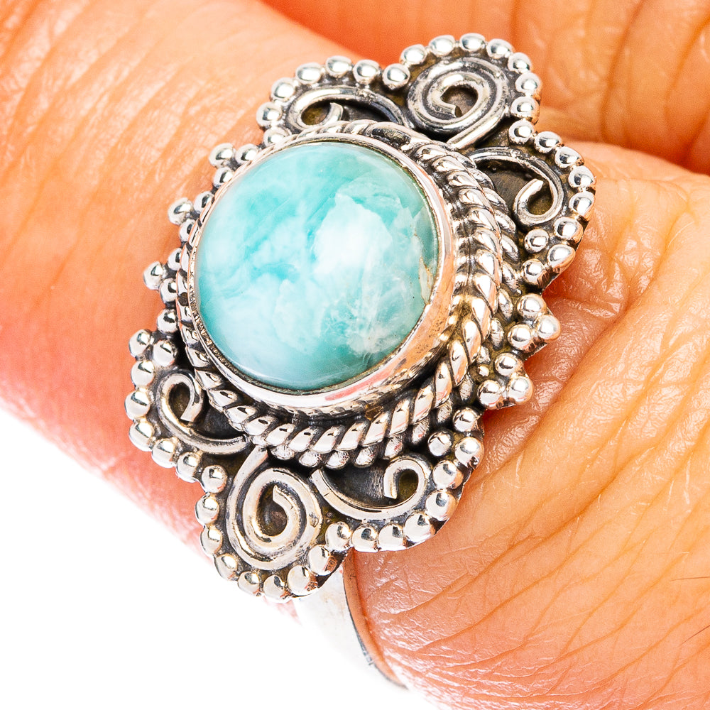 Sterling silver ring with oval larimar blue stone and scalloped filigree border